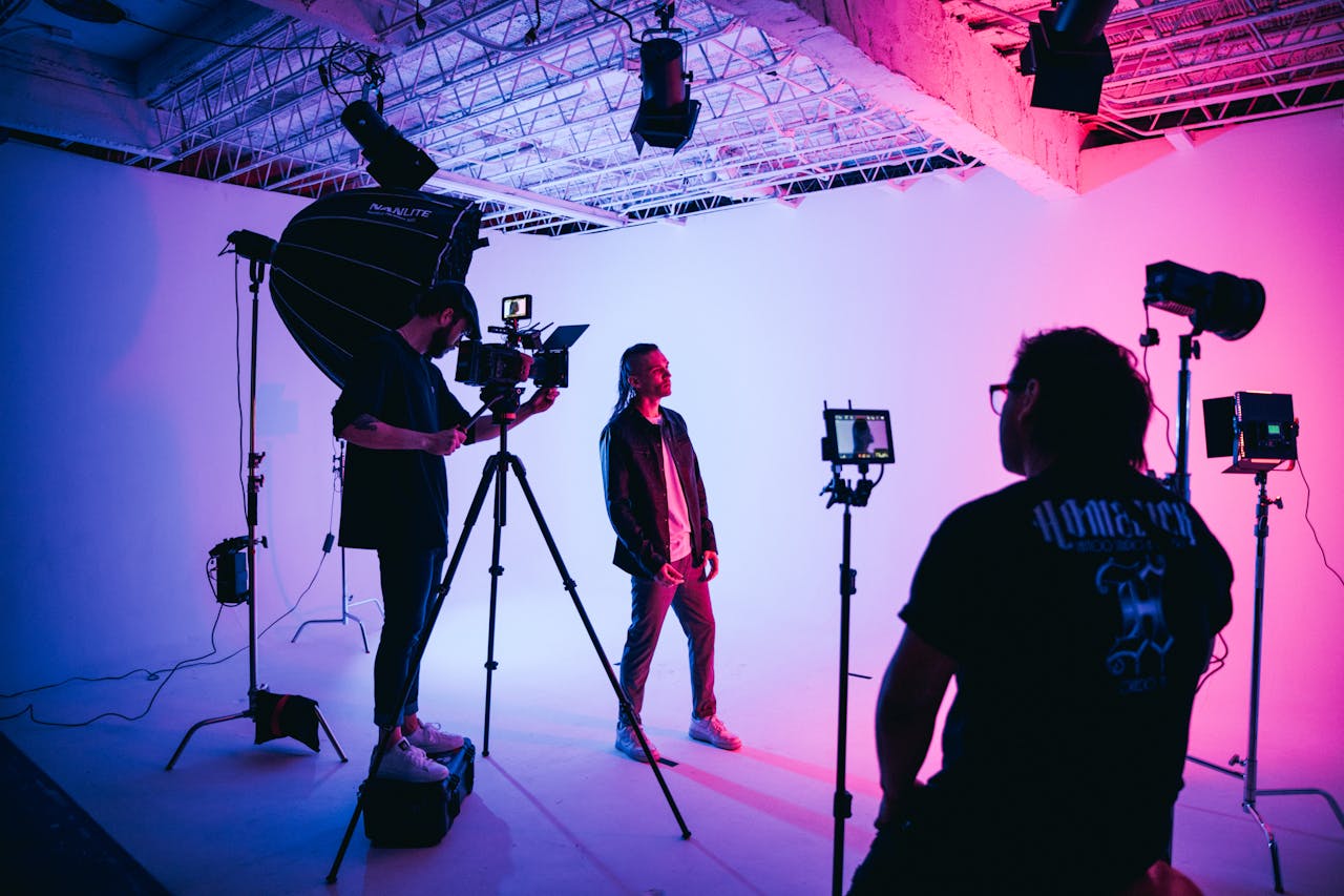 about-01 Cinematic setup in a studio with colorful stage lighting showcasing video production.